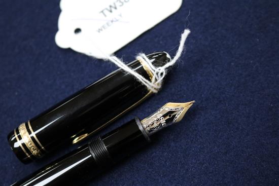 A Montblanc Meisterstuck black lacquered fountain pen, 14K gold nib, mint, in original leather pouch and box (1)